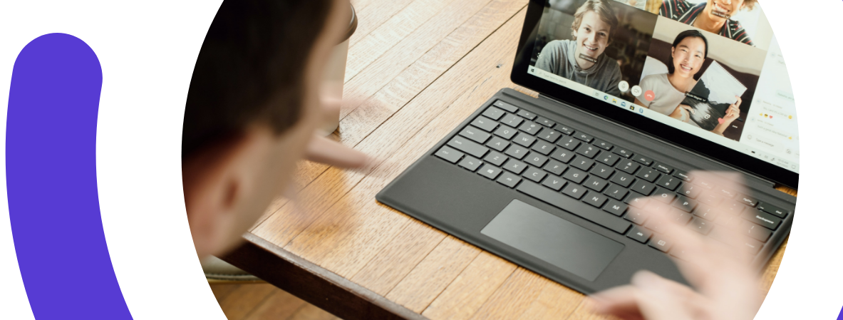 Man calling with colleagues on a laptop